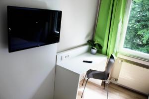 En TV eller et underholdningssystem på Rheinsteig Quartier by bestprice Hotels