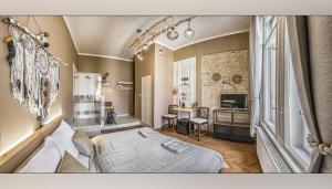 Postel nebo postele na pokoji v ubytování Boutique Suites Ráday