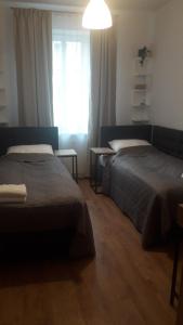 Posteľ alebo postele v izbe v ubytovaní Apartamenty Irena Stare Miasto Św. Ducha