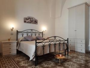 Postel nebo postele na pokoji v ubytování Casa Vacanze Lu Cumentu