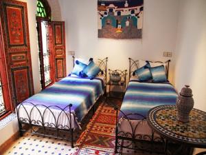 A bed or beds in a room at Dar Hafsa
