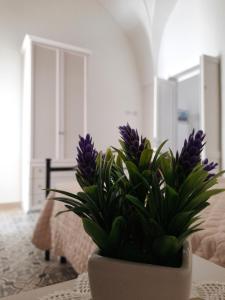 Postel nebo postele na pokoji v ubytování Casa Vacanze Lu Cumentu