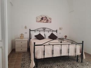 Postel nebo postele na pokoji v ubytování Casa Vacanze Lu Cumentu