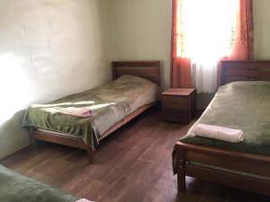 Postel nebo postele na pokoji v ubytování Guesthouse Omalo