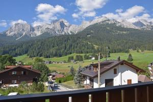 a view of the mountains from the balcony of a house at Design Residence Del Passo in Padola
