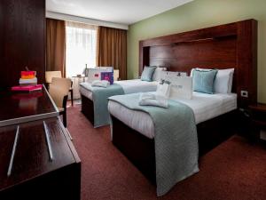 Postel nebo postele na pokoji v ubytování Treacy's Hotel Wexford