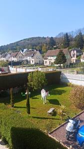 a statue of a horse in a yard at Chambre d'hote Le clos Valmont in Fécamp