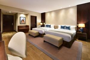 Cama ou camas em um quarto em Bahrain Airport Hotel Airside Hotel for Transiting and Departing Passengers only
