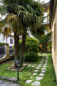 A garden outside New Inn Residence