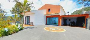 a house with a star on the driveway at Villa Luz - Family House Vacations- Large Private Outdoor Area in Santa Cruz