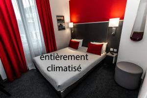 a hotel room with a bed with the words entertainment diminished at Hotel Continental in Angers