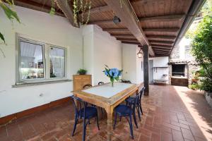 a dining room with a table and chairs at Luxury Country House Domaso in Domaso