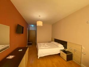 Postel nebo postele na pokoji v ubytování Hotel Continental