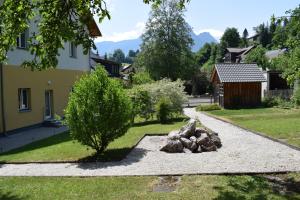 a garden with rocks in the middle of a yard at Frühstückspension Josefinum in Bad Aussee