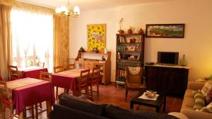 a living room with a couch and a dining room at El Balcón de Alange in Alange