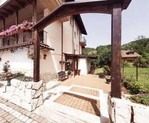 an entrance to a building with a wooden archway at Albergo del Sangro in Pescasseroli