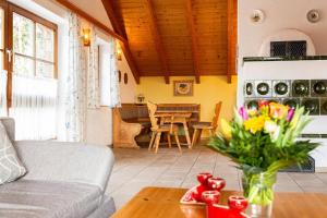 a living room with a couch and a table at Ferienhaus Killian in Bischofsmais