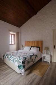 Postel nebo postele na pokoji v ubytování Quinta do Mirante 1785