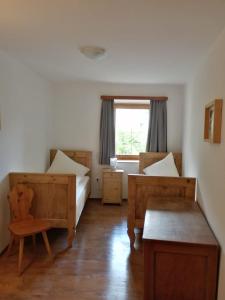 Postel nebo postele na pokoji v ubytování Garni Sonne