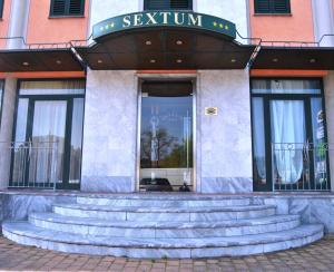 The facade or entrance of Hotel Sextum
