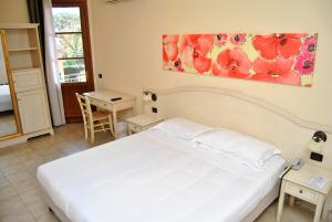 A bed or beds in a room at Hotel Sextum