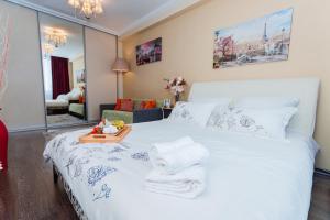 Kama o mga kama sa kuwarto sa Lakshmi Apartment Novy Arbat 3-bedroom