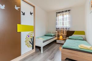 Postel nebo postele na pokoji v ubytování Apartment Livia