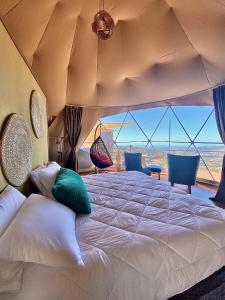 Postel nebo postele na pokoji v ubytování Kintiri Glamping
