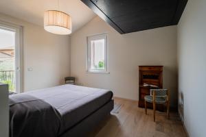 a bedroom with a bed and a window at La Casa 570 in Perugia