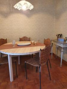 a dining room with a table and chairs at Casa 2 Gallos in Ourense +29 photos