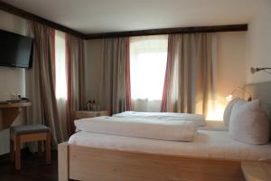 Postelja oz. postelje v sobi nastanitve Das Posch Hotel