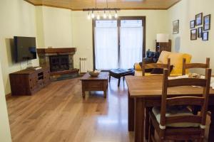 a living room with a couch and a table at Apartamento Toran in Les