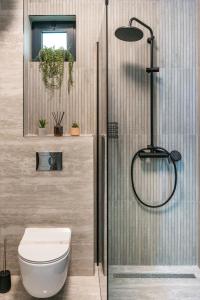 a bathroom with a toilet and a shower at Skywalker Royal in Dubrovnik