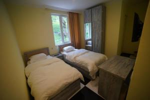 Postel nebo postele na pokoji v ubytování Khikhani Palace