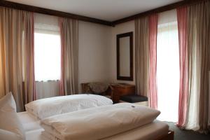 Postelja oz. postelje v sobi nastanitve Das Posch Hotel