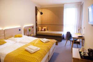 Tempat tidur dalam kamar di Hotel Golf Depandance
