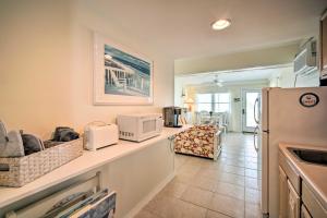 a kitchen with a counter top with a refrigerator at Charming Oceanfront Condo, Walk to Wildwood Beach in Wildwood Crest