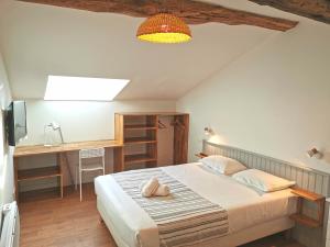 Cama o camas de una habitación en Appart'Hôtel Bellevue