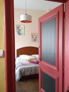 Giường trong phòng chung tại Villa Imaginaire
