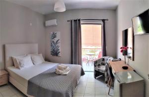 A bed or beds in a room at Nini's House 2 - 100m from beach NIDRI TOWN CENTER