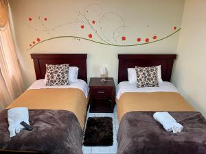 Postel nebo postele na pokoji v ubytování Hotel Casa Santa Lucía