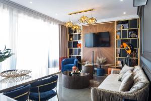 a living room with a couch and a tv at Skywalker Royal in Dubrovnik