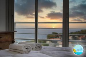 Ένα ή περισσότερα κρεβάτια σε δωμάτιο στο UNE TERRASSE SUR LA MER 3 pers 2 chambres VUE MER