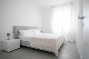 Postel nebo postele na pokoji v ubytování IseoLakeRental - Trivia Resort + 14 fotografií