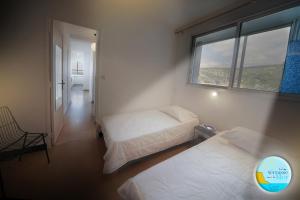 Ένα ή περισσότερα κρεβάτια σε δωμάτιο στο UNE TERRASSE SUR LA MER 3 pers 2 chambres VUE MER +11 φωτογραφίες