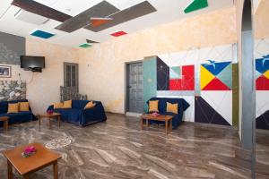 a living room with a painting on the wall at Hotel Korakakis Beach in Finikounta