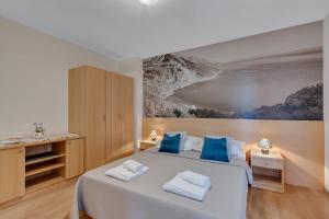 Posteľ alebo postele v izbe v ubytovaní Apartments Vranjes
