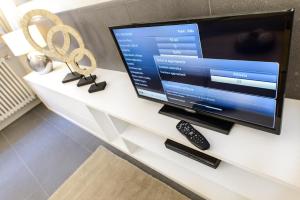 Una televisión o centro de entretenimiento en Easydomus Rome