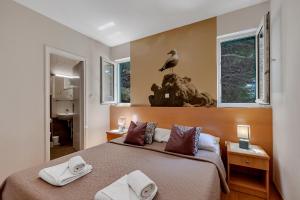 Posteľ alebo postele v izbe v ubytovaní Apartments Vranjes