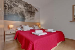 Posteľ alebo postele v izbe v ubytovaní Apartments Vranjes